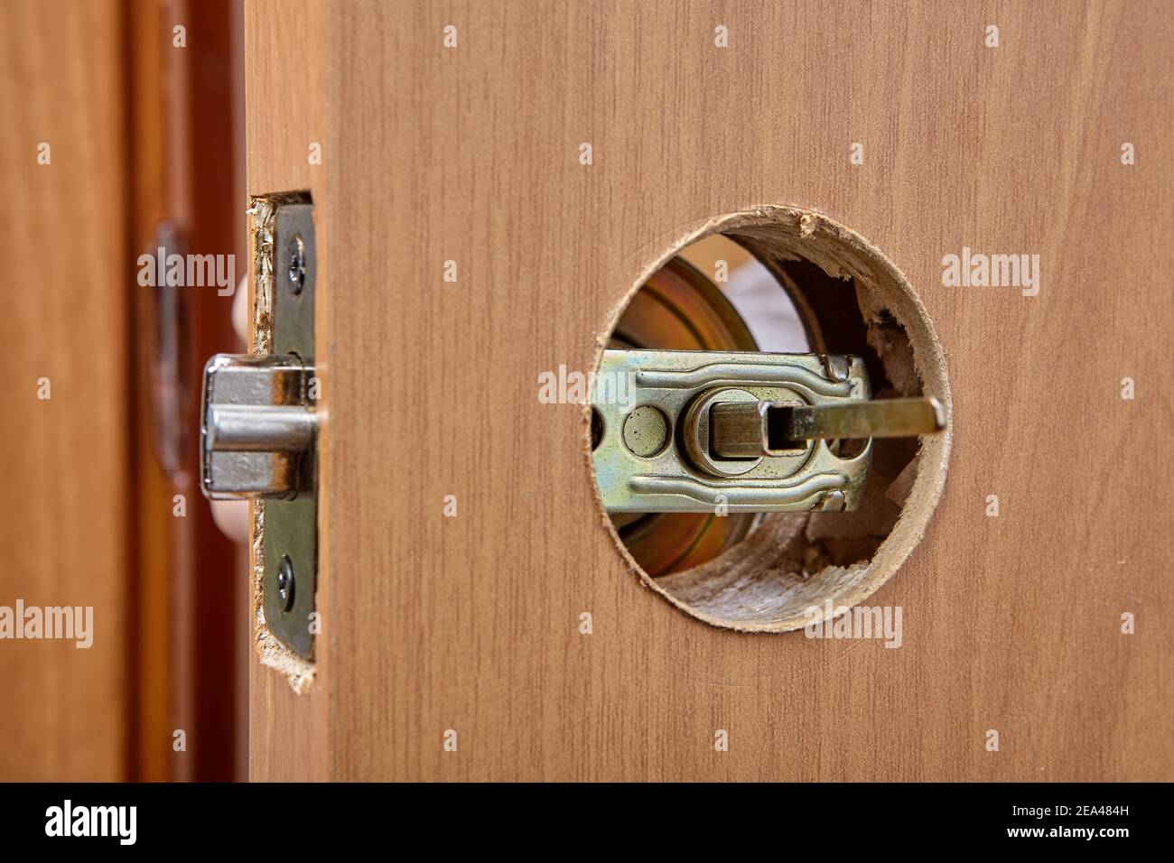 Door handle mechanism shutter is visible in hole of latch assembly