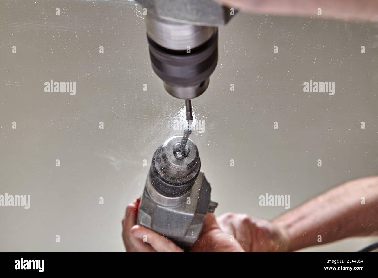 Tools for creating holes in glass, mirror, and tiles, electric drill with special bit. Stock Photo