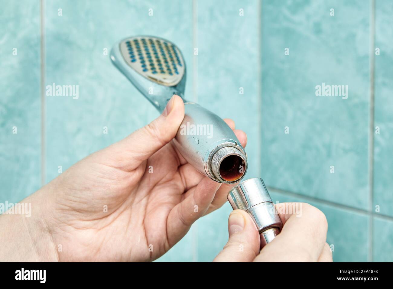 Removing old rusted shower head in bathroom Stock Photo Alamy