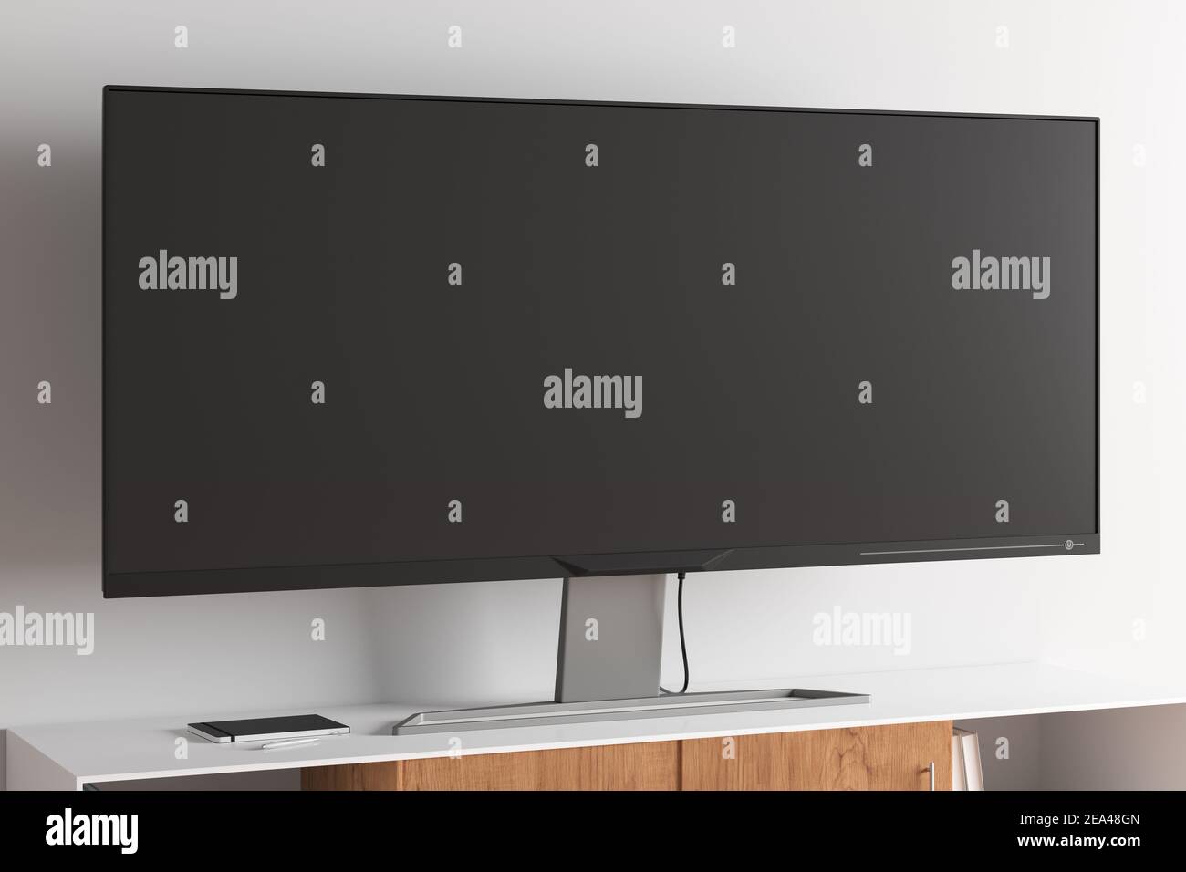 TV wide screen on the TV stand in modern living room with white wall