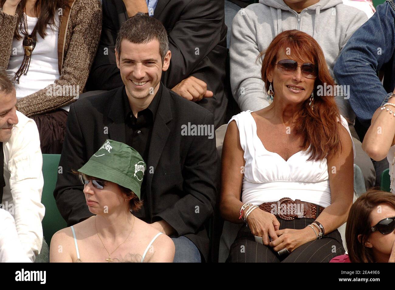 French singer Julie Pietri and french actor Bruno Putzulu attend the match between Spain's Rafael Nadal and Swiss Roger Federer in the semi final of the French Open at the Roland Garros stadium in Paris, France on June 03, 2005. Photo by Gorassini-Zabulon/ABACA. Stock Photo