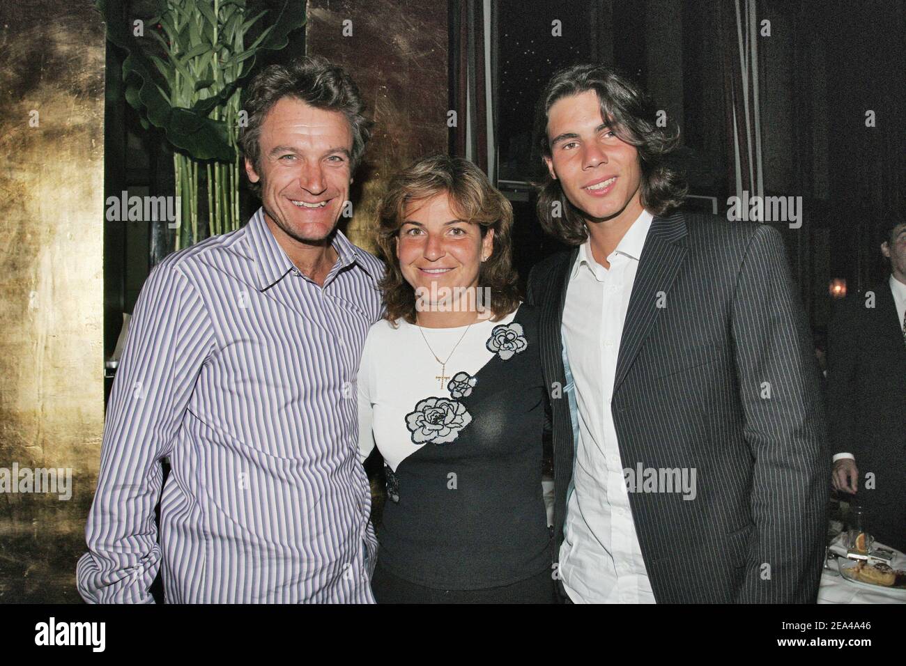 EXCLUSIVE. Spanish 2005 Roland Garros winner Rafael Nadal poses with  Spanish player Arantxa Sanchez-Vicario and Swedish Mats Wilander while  celebrating his victory at the 'Cafe de l'Homme', a restaurant overlooking  the Eiffel