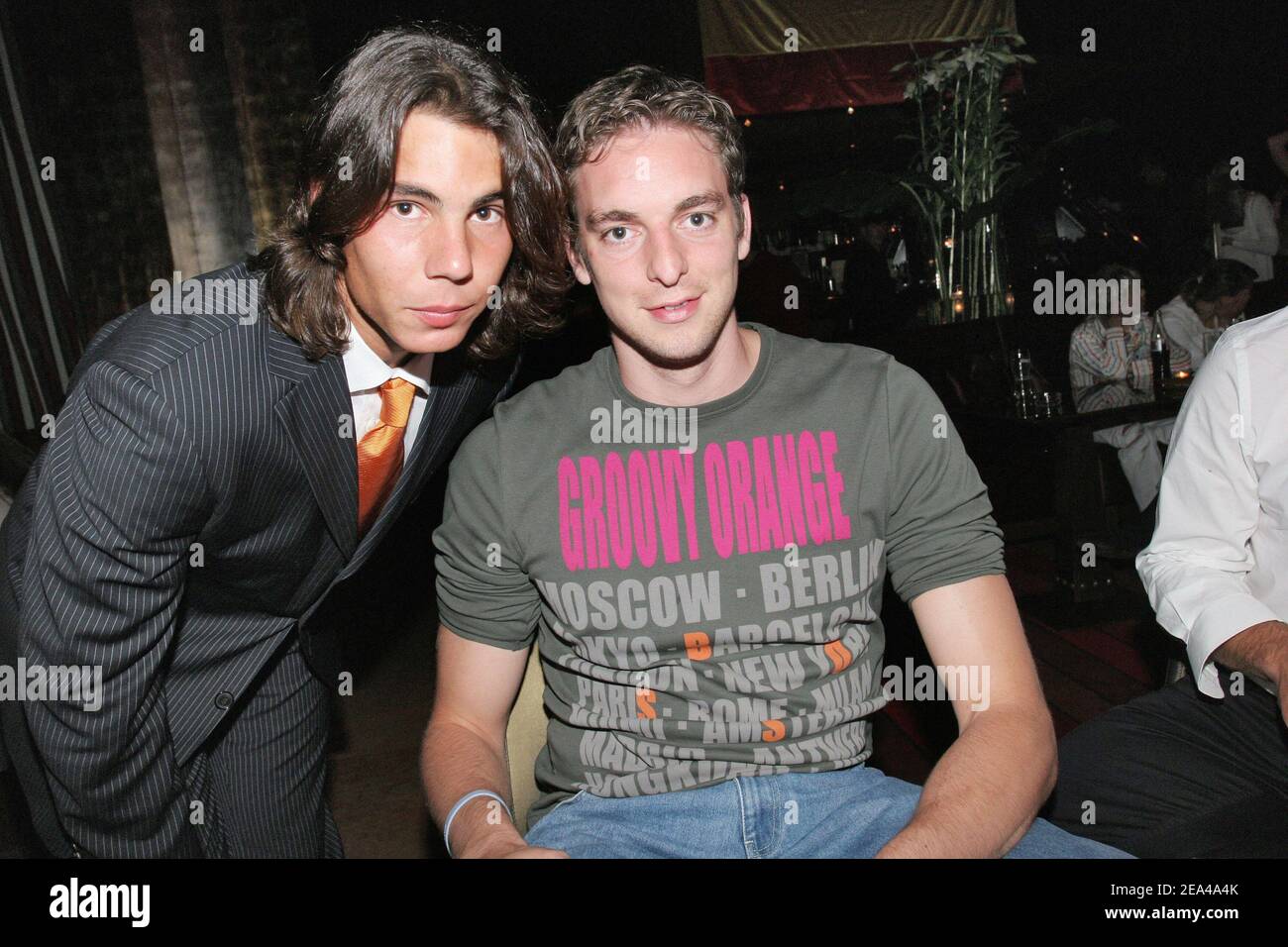 EXCLUSIVE. Spanish tennis ace and 2005 Roland Garros winner Rafael Nadal poses with NBA spanish player Pau Gasol while celebrating his victory at the 'Cafe de l'Homme', a restaurant overlooking the Eiffel Tower at the Trocadero, in Paris, France, on June 5, 2005. Photo by Benoit Pinguet/ABACA. Stock Photo