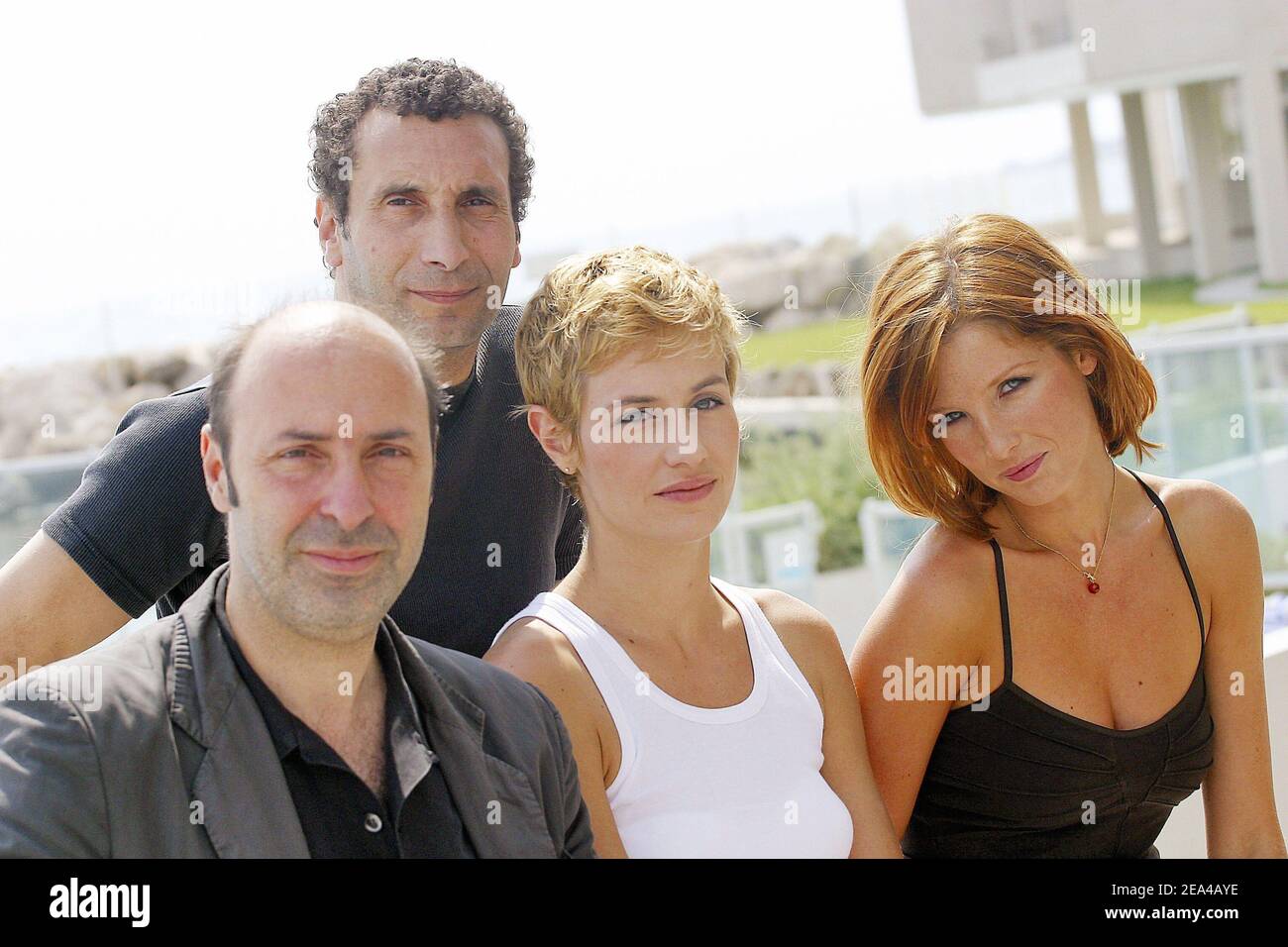 French director Cedric Klapisch (L) poses with the cast members (L-R)  Zinedine Soualem, Cecile de France and Kelly Reilly at the photocall for  his latest film, 'Les Poupees russes', held at the