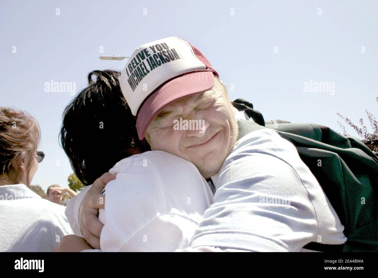 An emotional fan hugs a stranger after Michael Jackson is found innocent on all counts outside of the Santa Maria, CA Courthouse on June 13, 2005. Photo By Mark Velasquez/ABACA Stock Photo