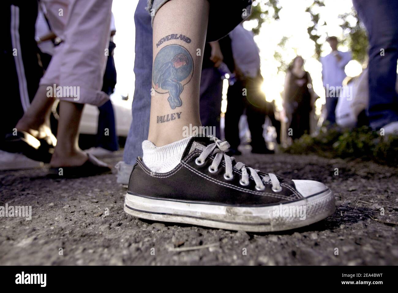 Katie Burrell (22) of Arizona shows off one of her two Michael Jackson  tattoos outside the Neverland Ranch in Santa Ynez, CA, USA, after the final  not guilty verdict. Photo by Jeff