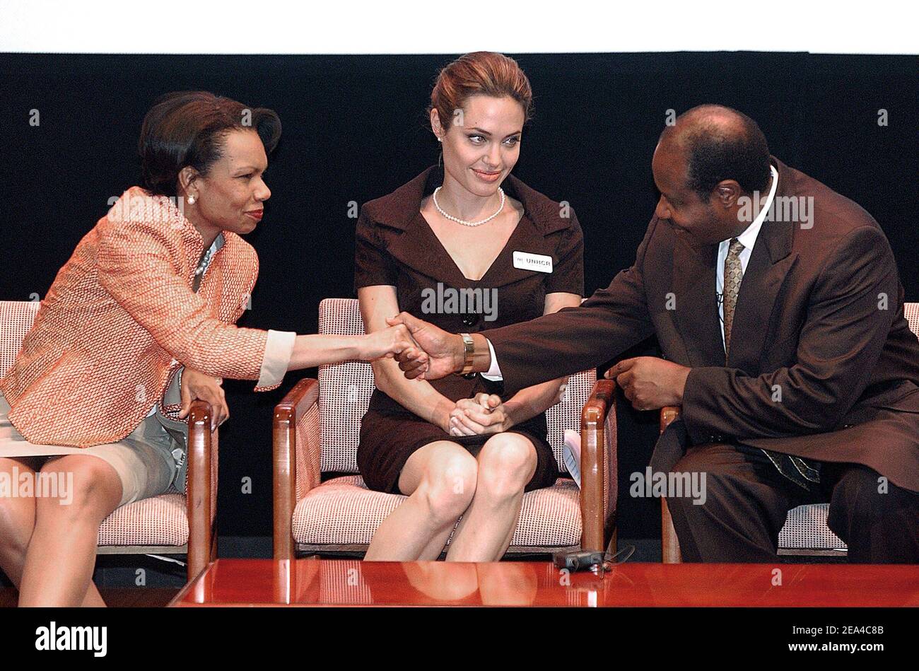 Secretary of State Condoleezza Rice attends an event to commemorate World Refugee Day with Angelina Jolie, actress and United Nations High Commissioner for Refugees goodwill ambassador and refugee speaker Paul Rusesabagina at the National Geographic Museum on June 15, 2005 in Washington, DC, USA. Photo by Olivier Douliery/ABACA. Stock Photo