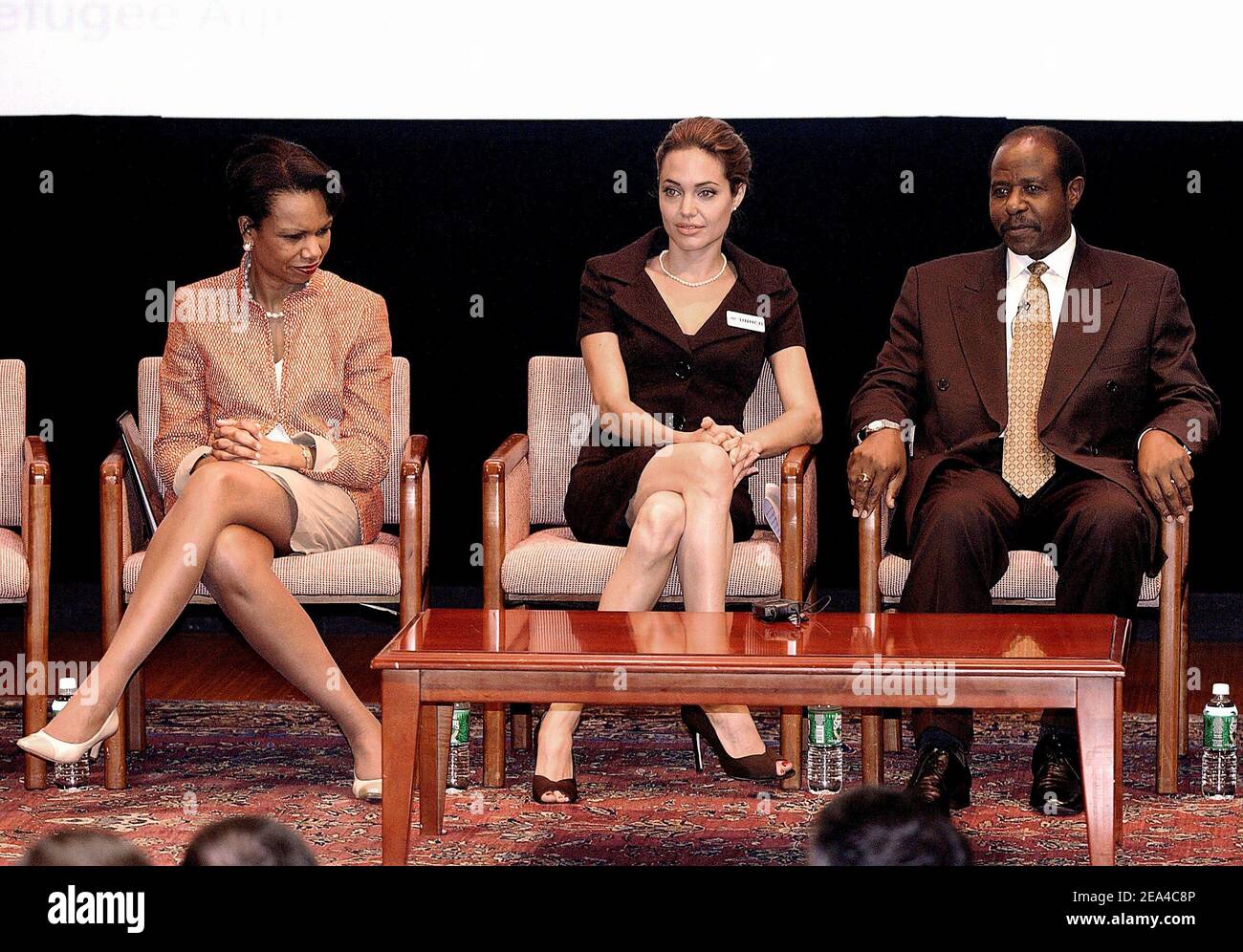 Secretary of State Condoleezza Rice attends an event to commemorate World Refugee Day with Angelina Jolie, actress and United Nations High Commissioner for Refugees goodwill ambassador and refugee speaker Paul Rusesabagina at the National Geographic Museum on June 15, 2005 in Washington, DC, USA. Photo by Olivier Douliery/ABACA. Stock Photo