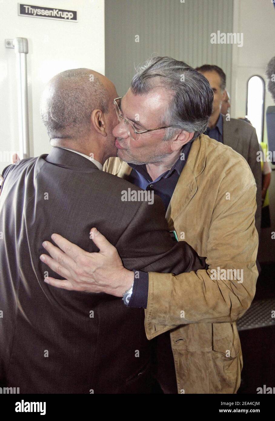 Iraqi interpreter Hussein Hanoun is greeted by French daily Liberation director Serge July as he arrives at the airport of Orly, near Paris, 16 June 2005. Hanun and Aubenas were free on June 12, 2005 after five-month hostage ordeal in Iraq. Photo Pool by Jack Guez/ABACA. Stock Photo