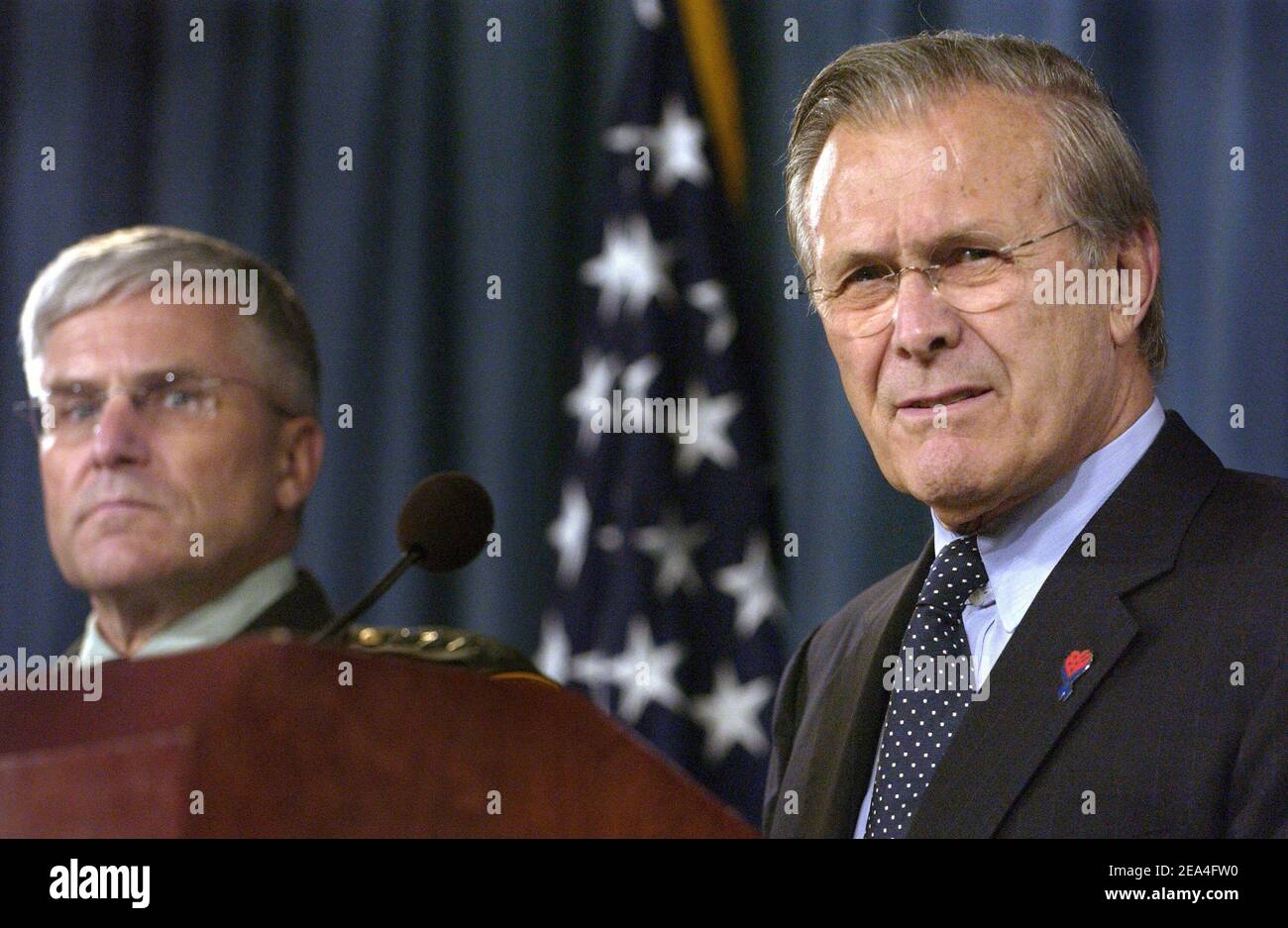 Defense Secretary Donald H. Rumsfeld, right, responds to reporter's questions during a press conference with Commanding General, Multi-National Force-Iraq Gen. George W. Casey about U.S. military strategy in Iraq at the Pentagon, June 27, 2005. DoD photo by Tech. Sgt. Cherie A. Thurlby, U.S. Air Force/ABACAPRESS.COM Stock Photo