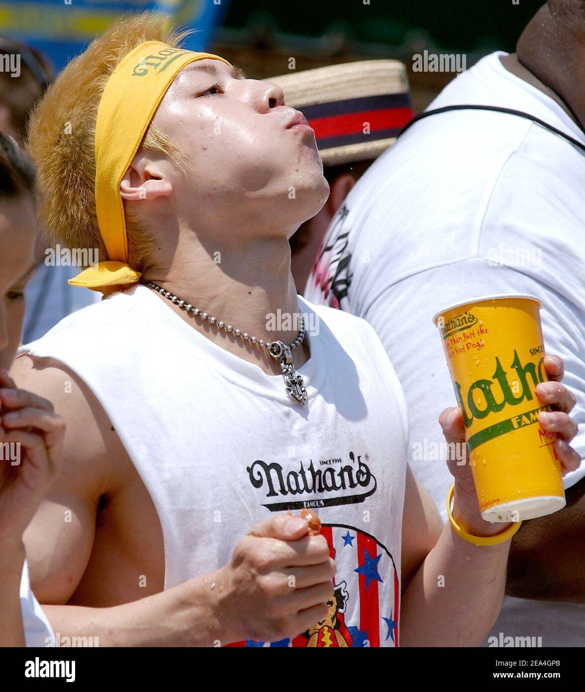 Japan's world champion Takeru Kobayashi gulps down hot dogs during the 2005 Nathan's Famous 4th of July International Hot Dog Eating Contest held in Coney Island, New York City, USA, on Monday July 4, 2005. Photo by Nicolas Khayat/ABACAPRESS.COM Stock Photo