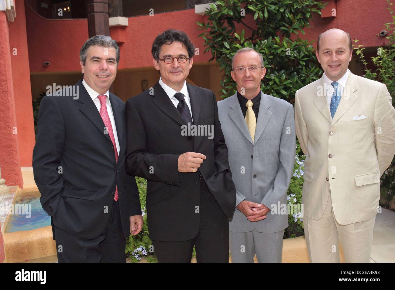 (L to R) French doctors specialists on Alzheimer disease, Bruno Dubois, Olivier de Ladoucette, Andre Delacourte, Jacques Touchon during a charity diner organized by Marisa Pavan (Jean-Pierre Aumont's ex wife) for URMA (Alzheimer research) at the hotel 'Byblos' in Saint-Tropez, France on July 13, 2005. Photo by Benoit Pinguet/ABACAPRESS.COM Stock Photo