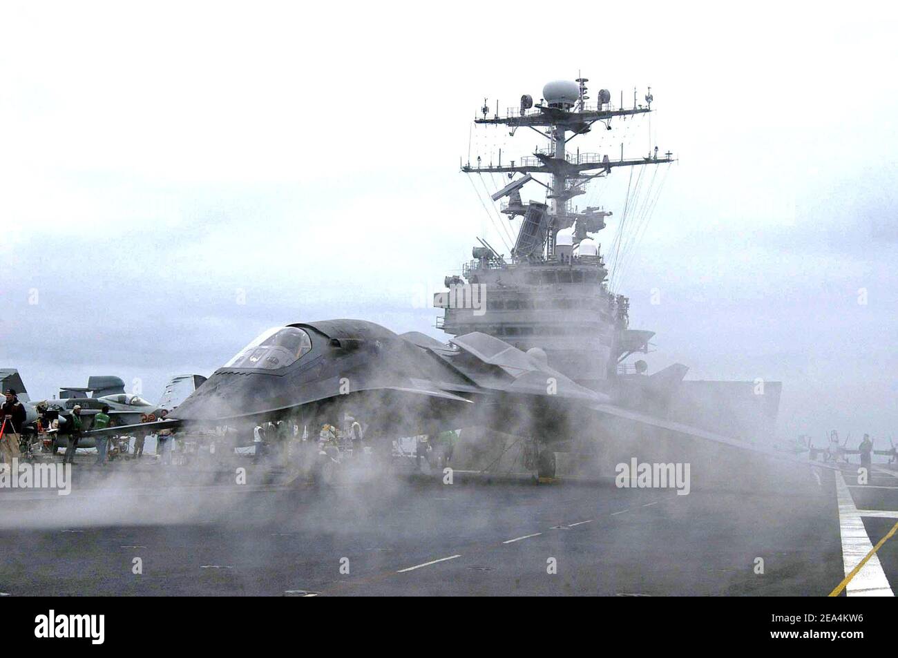 'The ficticious aircraft from the upcoming movie ''Stealth'' prepares to launch during a scene filmed for the upcoming movie ''Stealth'' on the flight deck of USS Abraham Lincoln on June 18, 2004. Photo by USN via ABACAPRESS.COM' Stock Photo