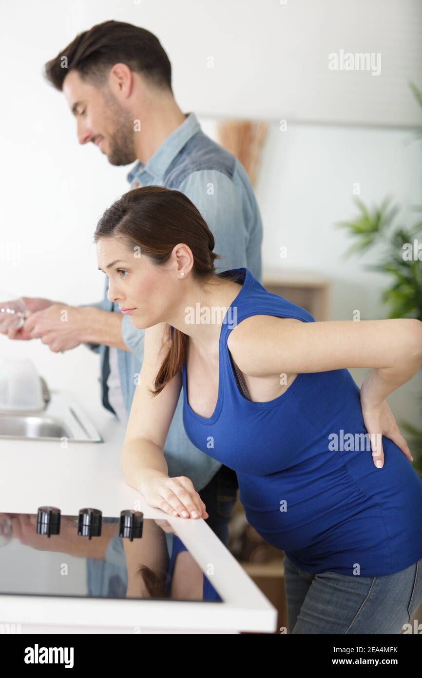 pregnant woman suffering from back ache Stock Photo