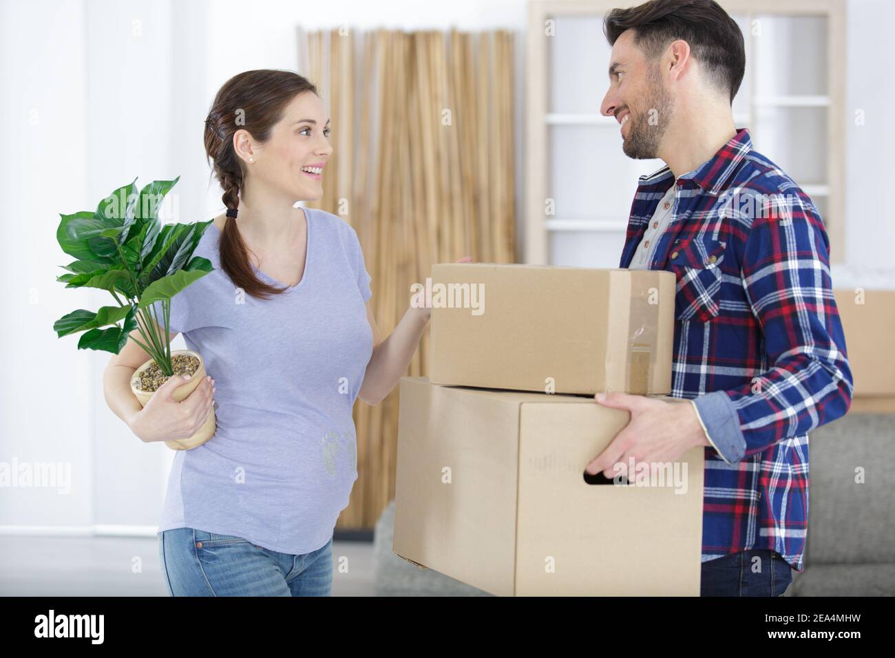 pregnant couple moving in a new house Stock Photo Alamy