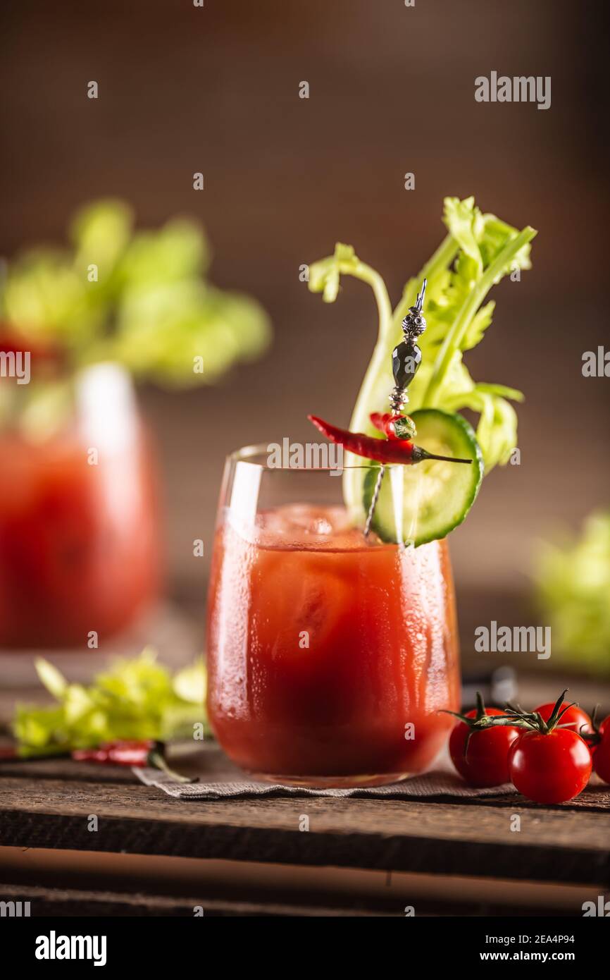 Hangover cure in a form of virgin mary cocktail with tomato and lemon juice, tobasco, salt, ground pepper and worcester sauce. Stock Photo