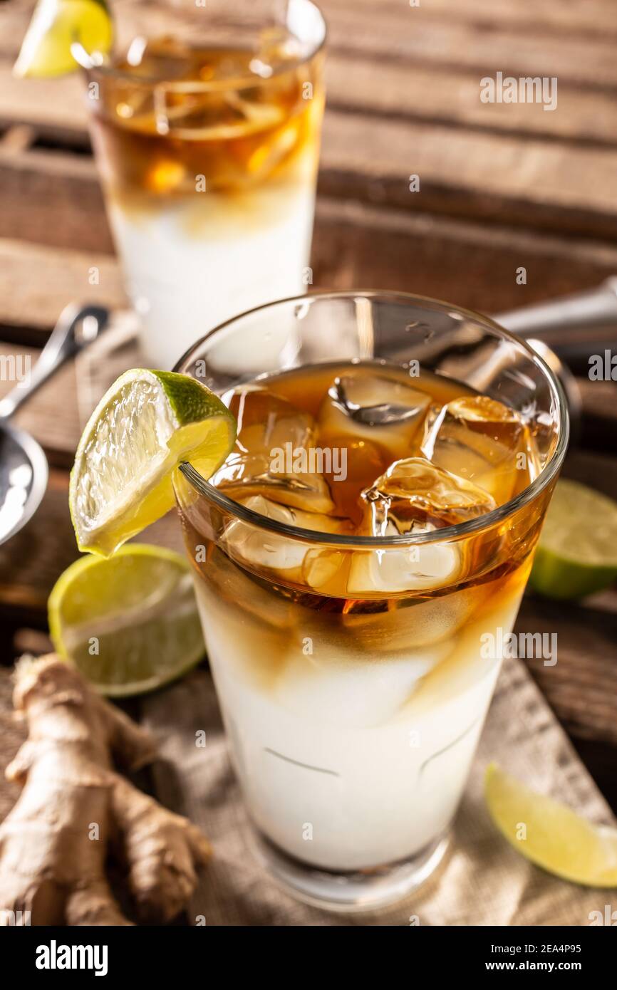 Dark n Stormy highball cocktail served as a long drink with rum, fresh lime juice, and ginger beer. Stock Photo