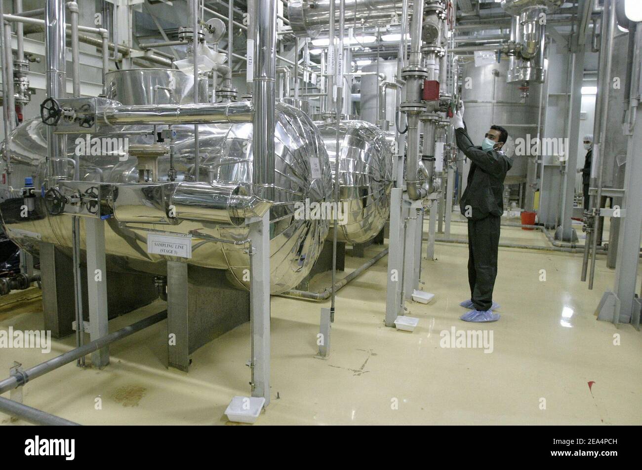 An Iranian technician works in the Uranium Conversion Facility (UCF) in Isfahan, Iran, on November 20, 2004. Iran said nuclear processing is set to resume at the Isfahan plant, the largest of its type in the country, on Wednesday. France, Britain and Germany have warned Iran of a major international crisis if the country goes ahead with its plans. Photo by ABACAPRESS.COM Stock Photo