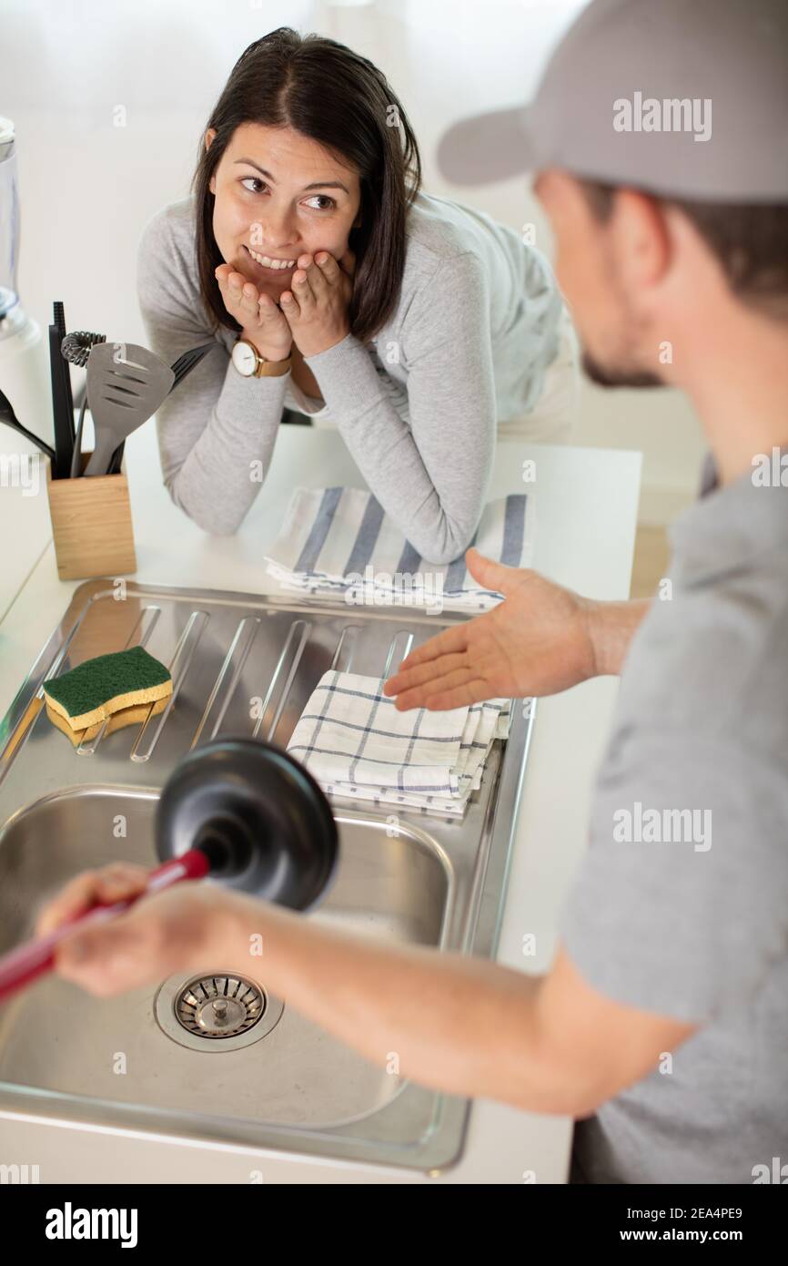 an using plunger in kitchen sink Stock Photo Alamy