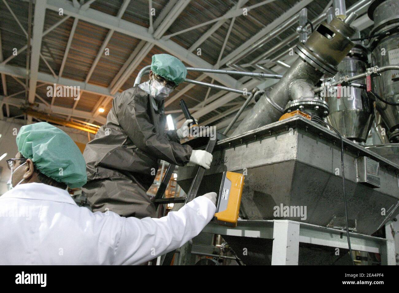 Iranian technicians work in the Uranium Conversion Facility (UCF) in Isfahan, Iran, on November 20, 2004. Iran said nuclear processing is set to resume at the Isfahan plant, the largest of its type in the country, on Wednesday. France, Britain and Germany have warned Iran of a major international crisis if the country goes ahead with its plans. Photo by ABACAPRESS.COM Stock Photo