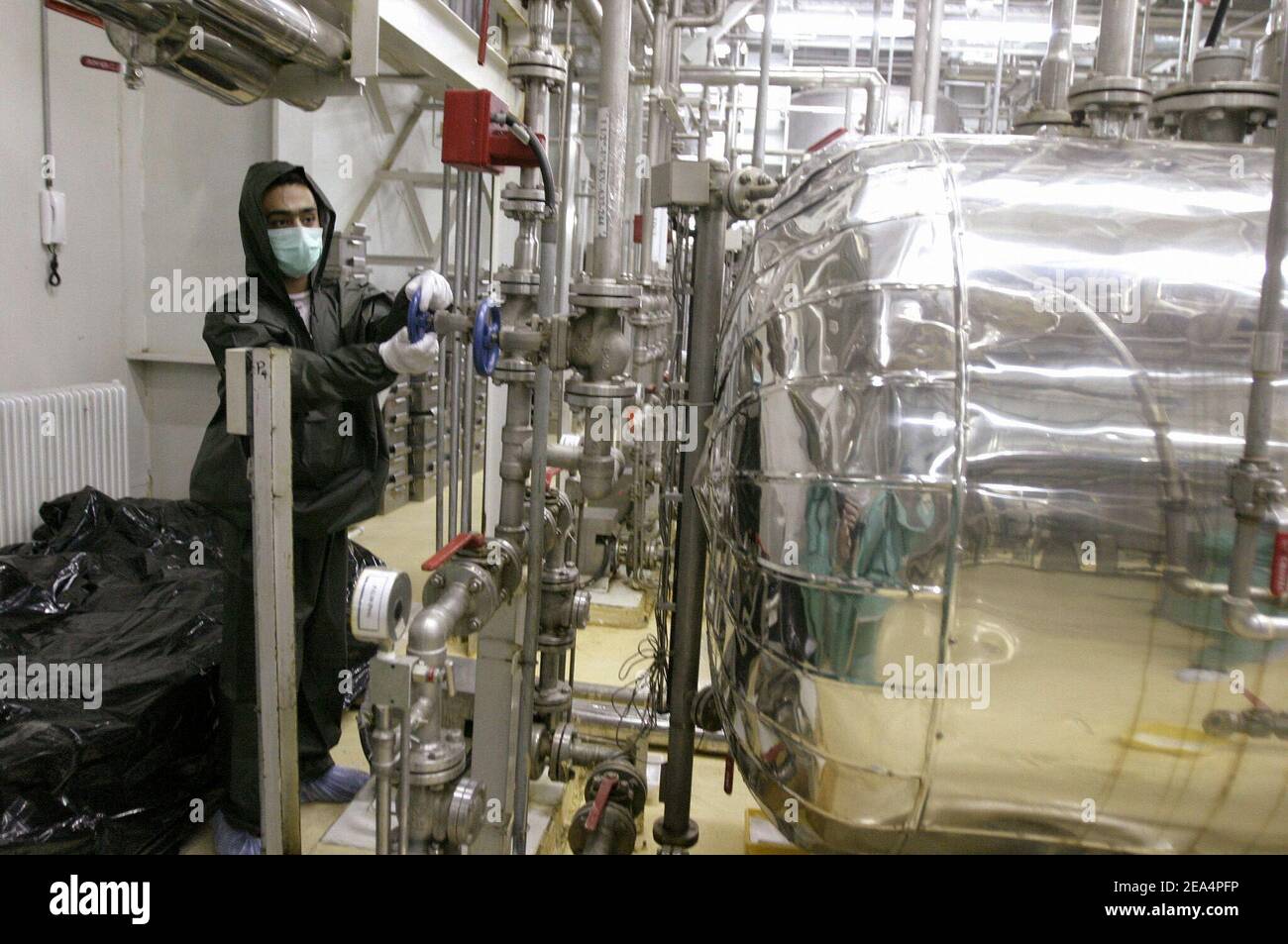 An Iranian technician works in the Uranium Conversion Facility (UCF) in Isfahan, Iran, on November 20, 2004. Iran said nuclear processing is set to resume at the Isfahan plant, the largest of its type in the country, on Wednesday. France, Britain and Germany have warned Iran of a major international crisis if the country goes ahead with its plans. Photo by ABACAPRESS.COM Stock Photo