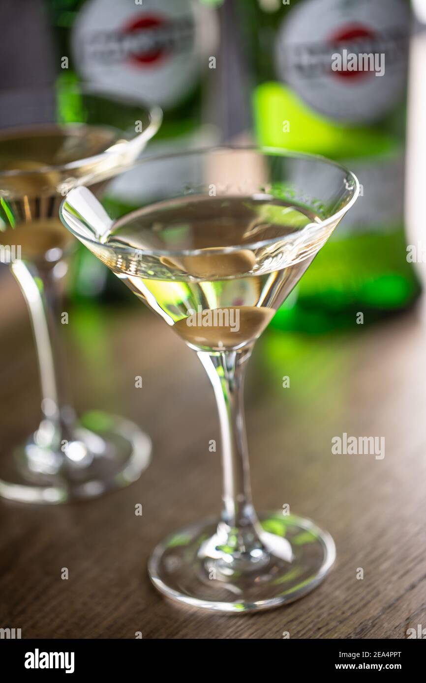 Dry Martini short drink cocktail with gin, dry vermouth and an olive garnish Stock Photo Alamy
