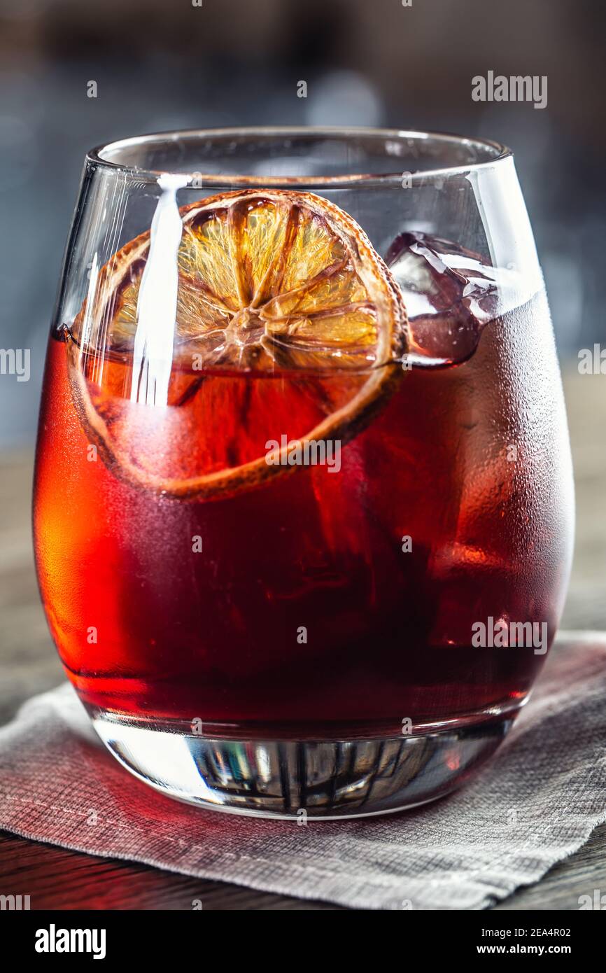 Negroni classic cocktail and gin short drink with sweet vermouth, red bitter liqueur and dried