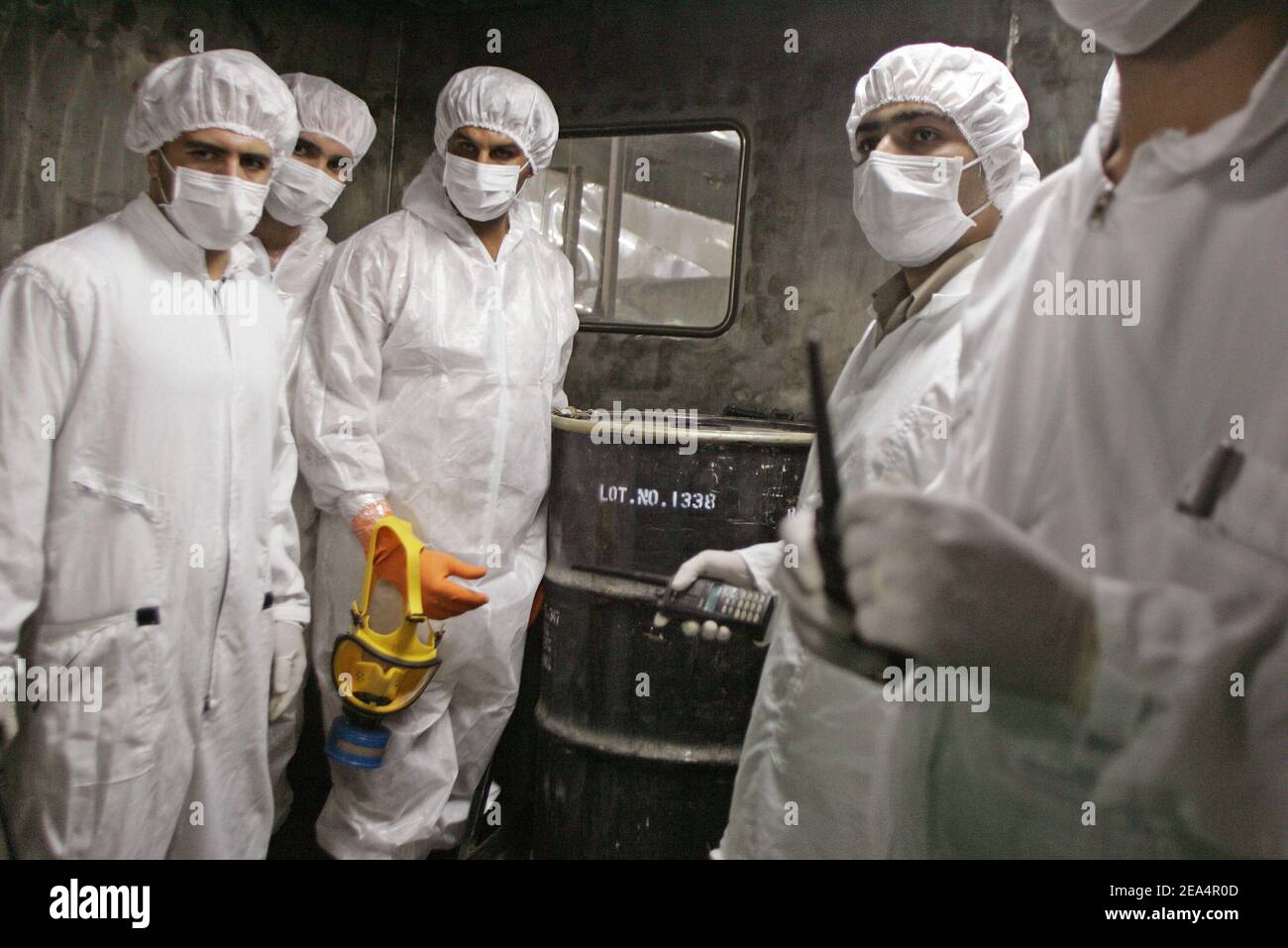Iranian technicians remove a container of radioactive uranium, 'yellow cake', sealed by the International Atomic Energy Agency, to be used at the Isfahan Uranium Conversion Facilities (UCF), 420 kms south of Tehran, Iran, on August 8, 2005. Iran looked set to resume sensitive nuclear fuel work imminently after the arrival of UN inspectors at a uranium conversion plant. Photo by ABACAPRESS.COM. Stock Photo
