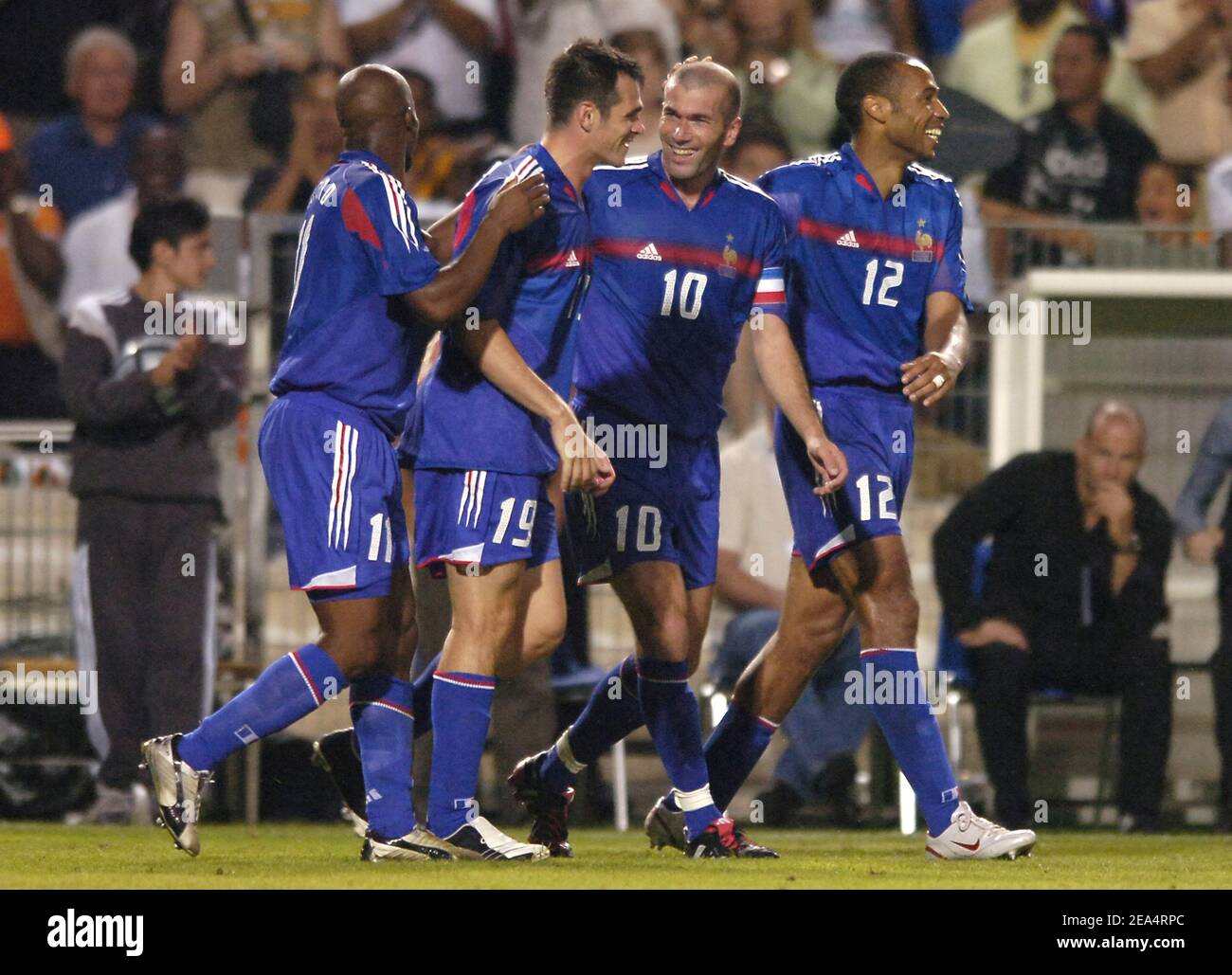 Zinedine Zidane of France is congratuled by his teammates after