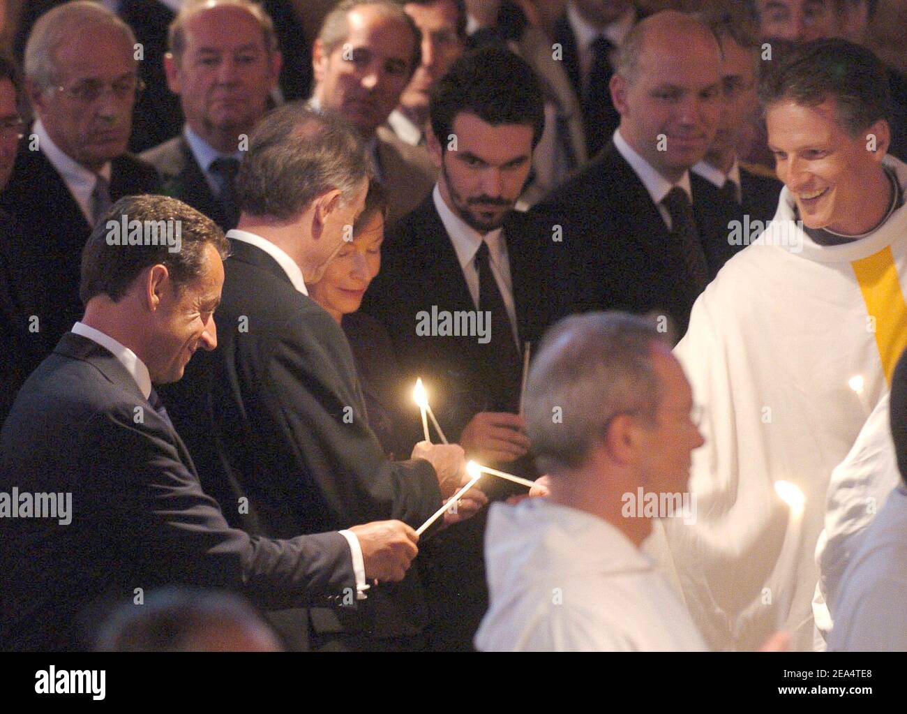 French Interior Minister Nicolas Sarkozy, German President Horst Koehler and his wife Eva attend the funeral of Brother Roger Schutz, the leader of the Taize ecumenical community, held at the community's Reconciliation church in Taize, central France, on August 23, 2005. Brother Roger, 90, was slain last week when a 36-year-old mentally disturbed Romanian woman slit his throat in front of 2,500 pilgrims praying at the church. Photo by Bruno Klein/ABACAPRESS.COM Stock Photo