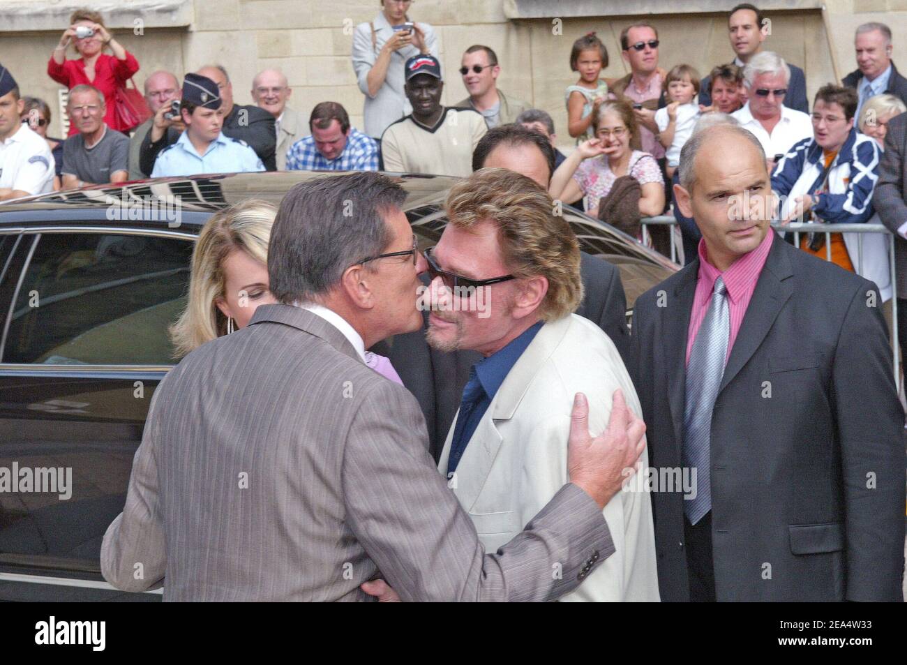 French producer Jean-Claude Camus and French singer Johnny Hallyday attend  French actress Mimie Mathy and Benoist Gerard's wedding at the city hall of  Neuilly-sur-Seine near Paris on August 27, 2005. Photo by