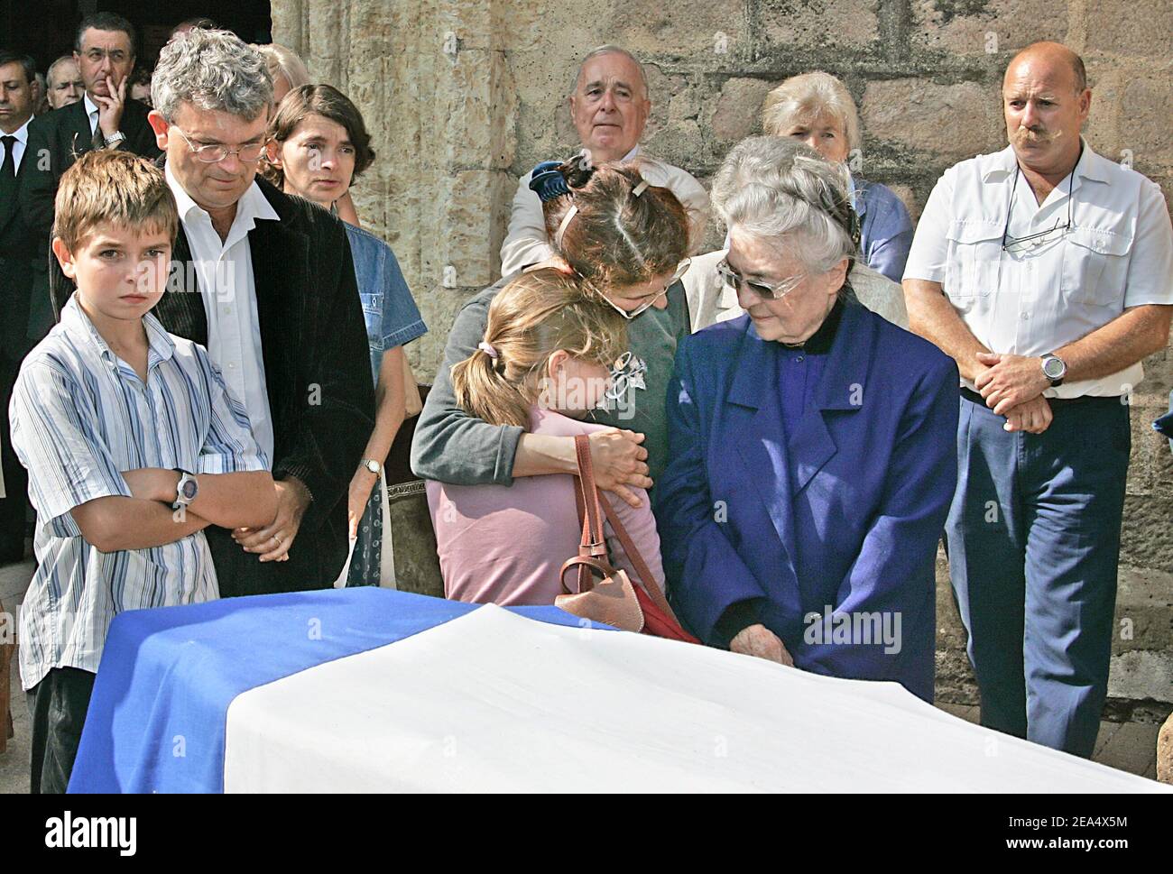 Jacques Dufilho's wife Colette (in blue), daughter Emmanuelle, grandson Jean-Baptiste,  granddaughter Agnes and stepson attend the funeral of the late French actor  held at the cathedral of Mirande, southwestern France, on August