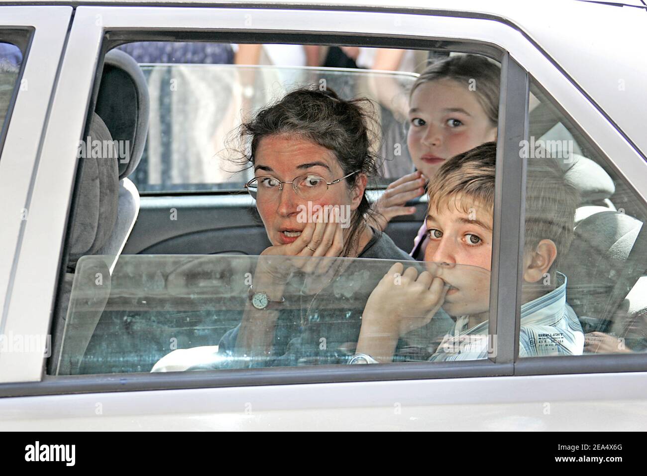 Jacques Dufilho's daughter Emmanuelle, grandson Jean-Baptiste and granddaughter Agnes leave the funeral of the late French actor held at the cathedral of Mirande, southwestern France, on August 31, 2005. Dufilho died on August 28 aged 91. Photo by Patrick Bernard/ABACAPRESS.COM. Stock Photo