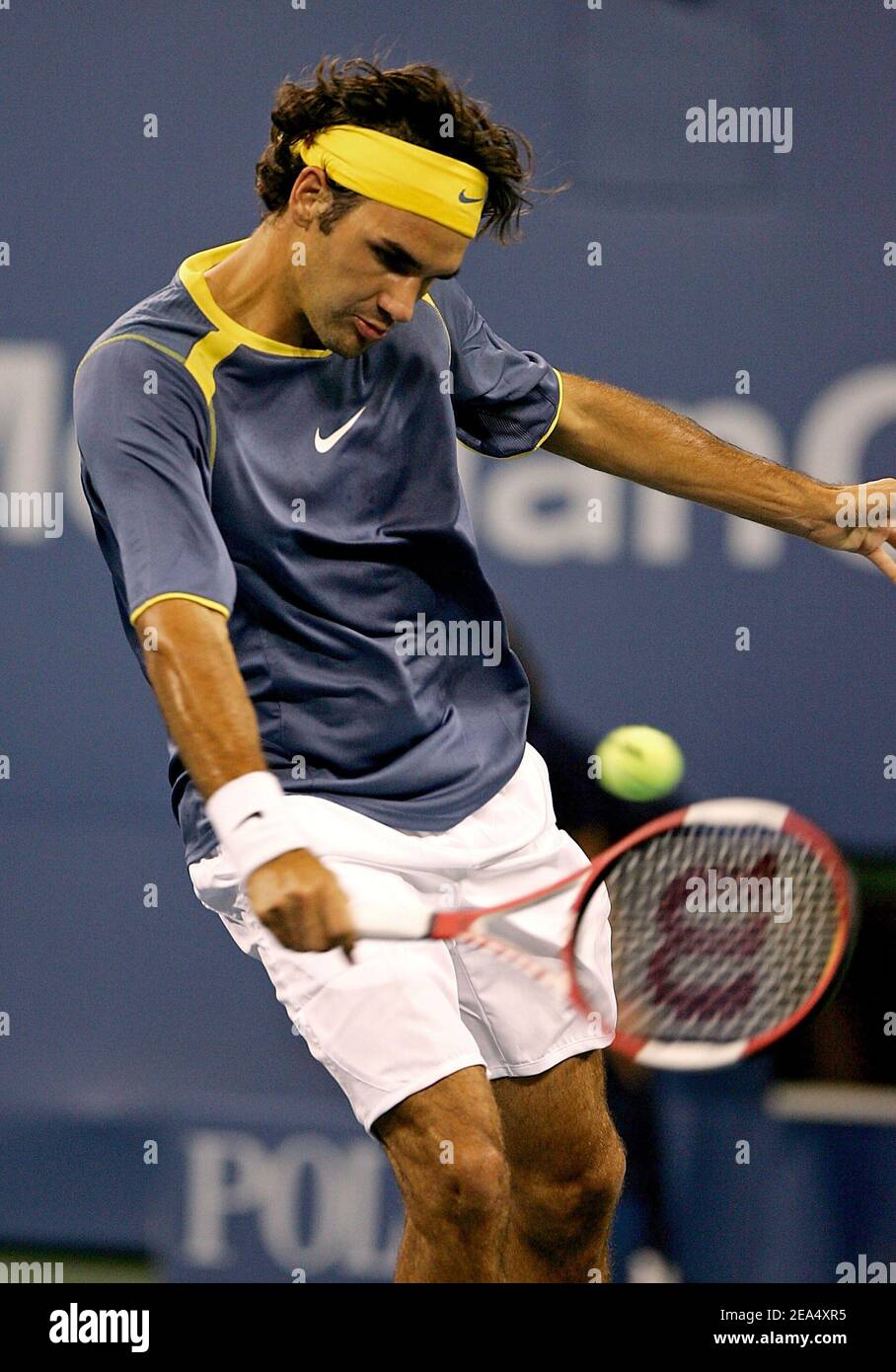 Switzerland's Roger Federer competes against France's Fabrice Santoro