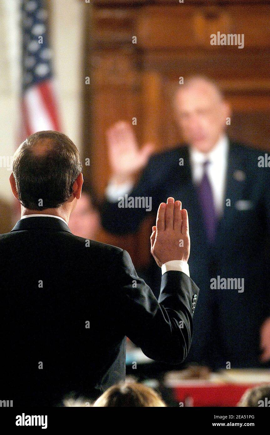 Judge John Roberts (L) is sworn-in by Judiciary Committee Chairman Sen. Arlen Specter during his confirmation hearings for Supreme Court Chief Justice on Capitol Hill in Washington, DC, USA, on September 12, 2005. The Senate began week-long confirmation hearings on the nomination of star jurist Roberts to be the next US Supreme Court chief justice, Pesident George W. Bush's first shot at reshaping the high court to reflect his conservative views, following the death of William Rehnquist 03 September. Photo by Olivier Douliery/ABACAPRESS.COM Stock Photo