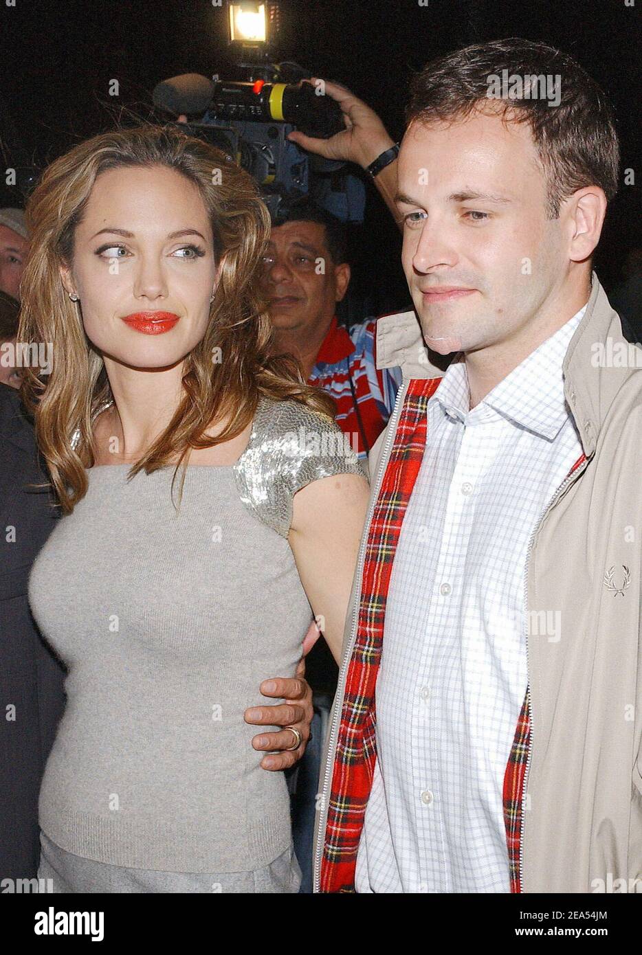 US actress Angelina Jolie and her ex-husband Johnny Lee Miller pose  together as they arrive at the 'Peace one Day' premiere screening held at  the Ziegfeld theatre in New York City, NY,