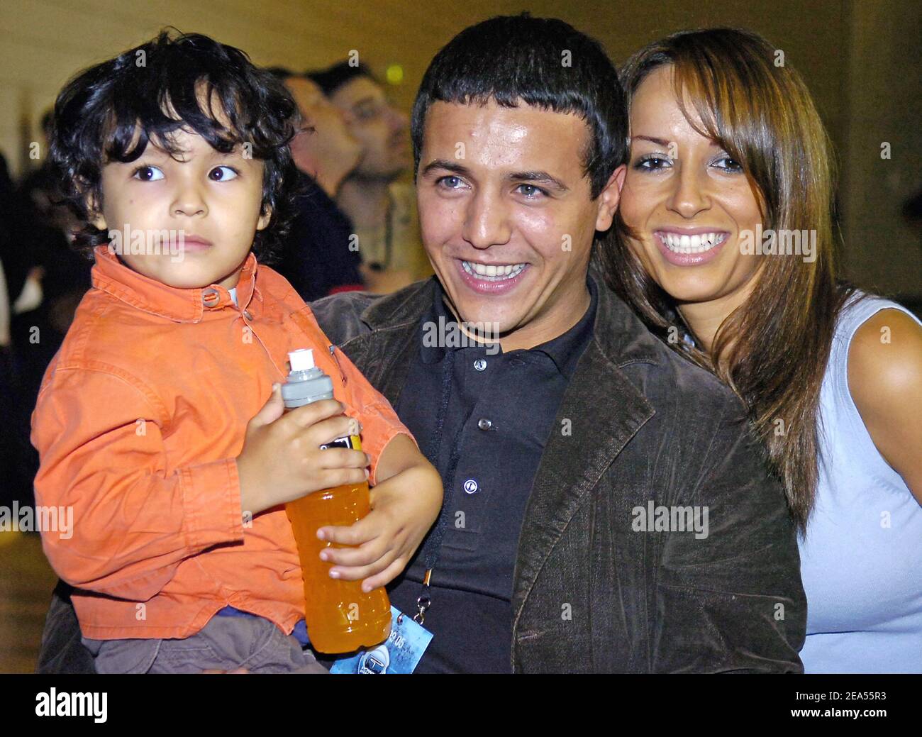 French singer Faudel with his wife Anissa and his son Anzy at French basket player Tony Parker of San Antonio Spurs and Powerade show in Issy-les-Moulineaux, near Paris, in France, on September 27, 2005. Photo by Nicolas Gouhier /CAMELEON/ABACAPRESS.COM Stock Photo