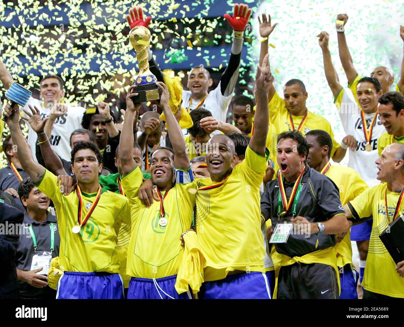 Brazil's soccer star Ronaldinho holds the achieved