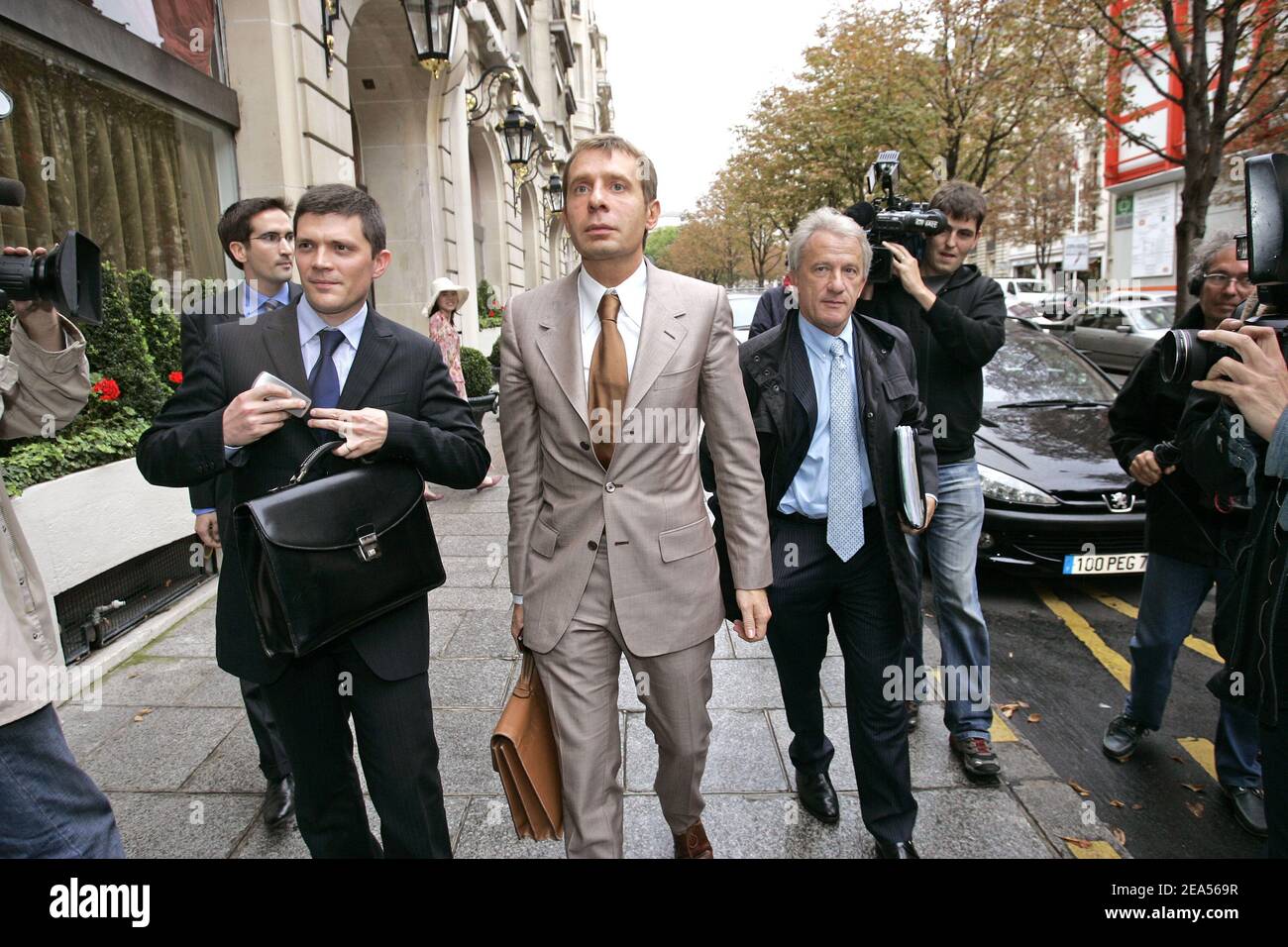 French businessman Bernard Tapie's lawyers leave Paris tribunal on  september 30, 2005 after the decision of the court to condemn French state  to pay 135 millions Euros to Bernard Tapie in the