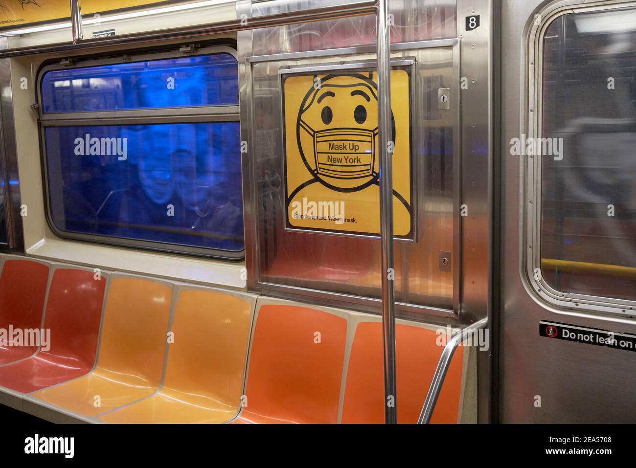 Mask up New York poster inside an empty subway train Stock Photo