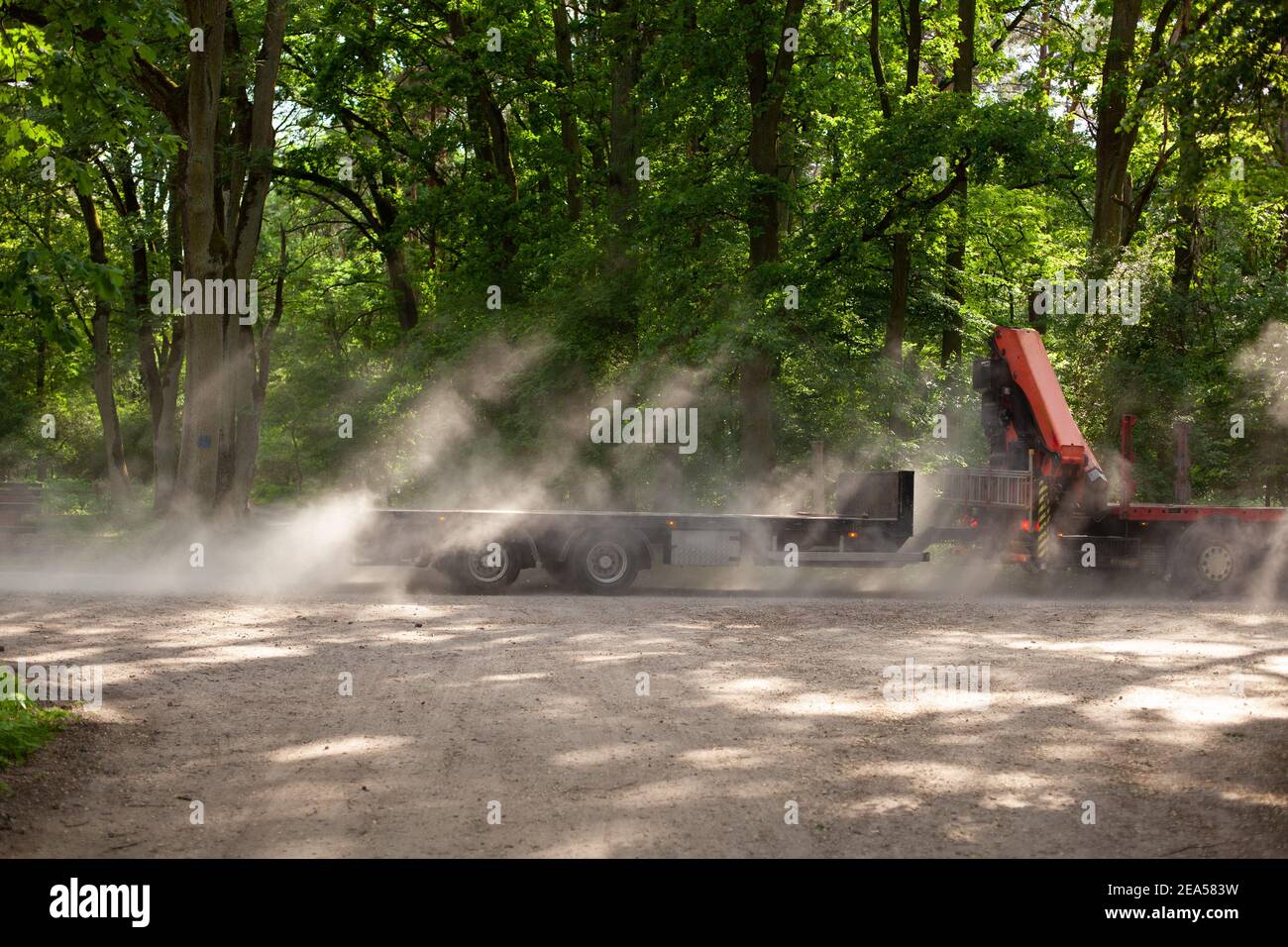 A truck with green trees in the backgorund Stock Photo - Alamy