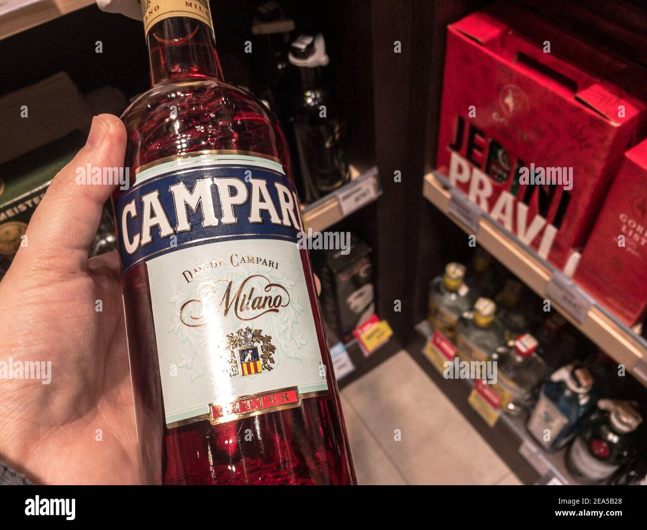 BELGRADE, SERBIA - FEBRUARY 1, 2021: Campari logo on some bottles for sale. Campari is a bitter alcohol used for spritz, a aperitif aperitivo drink fo Stock Photo