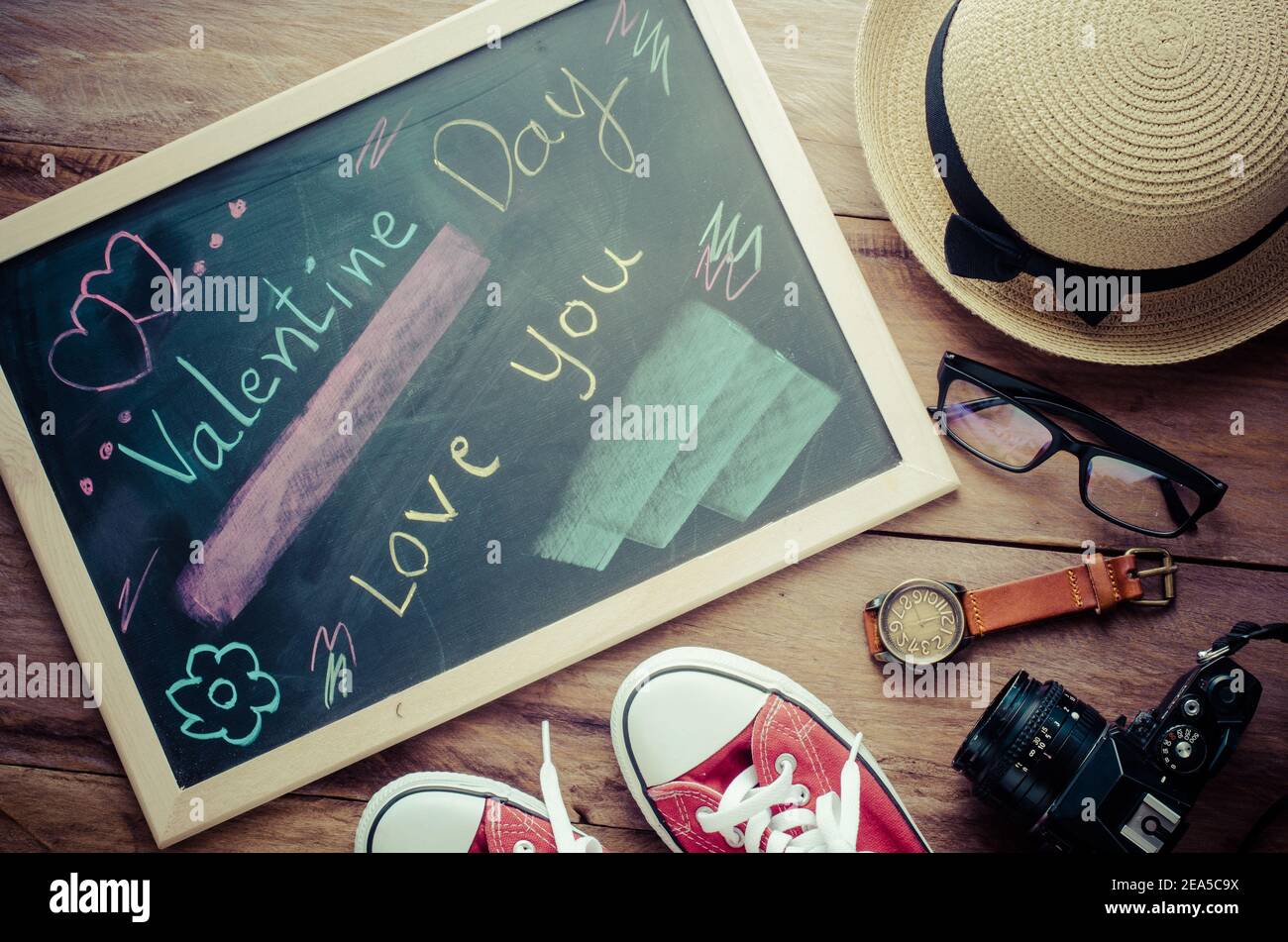 Blackboard with words written in shock that the 'VALENTINE DAY LOVE YOU' and costume for women was placed next to the board - the concept of Valentine Stock Photo