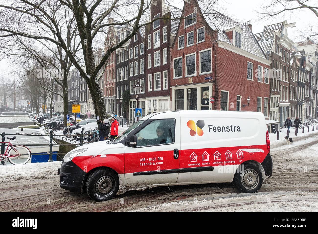 Amsterdam, The Netherlands, 7th February, 2021. The city centre brought to  a standstill after massive snow storm. Feenstra boiler repair utility car  Stock Photo - Alamy