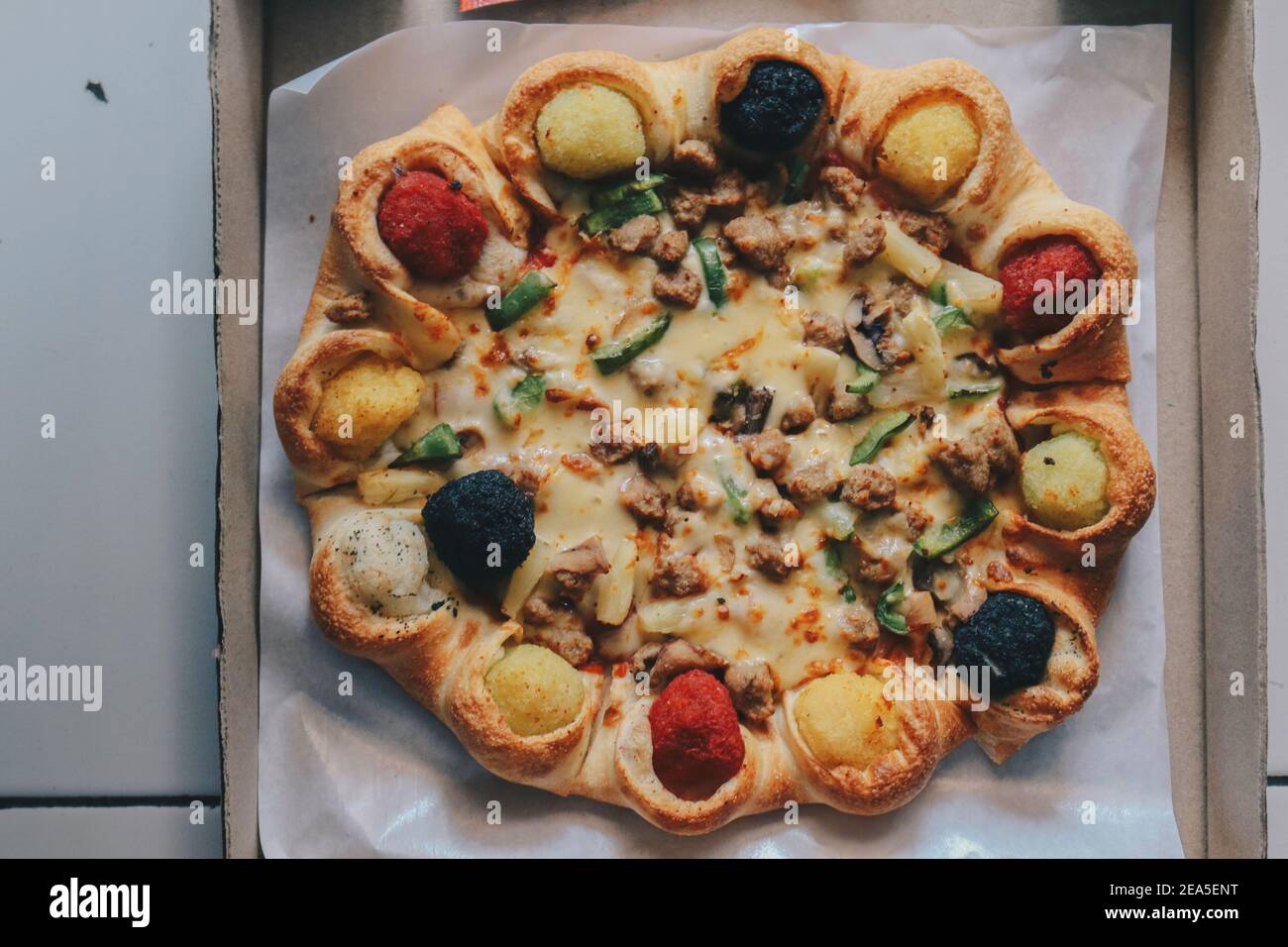 Mozzarella cheese Pizza in opened from the box with Colourful crust on