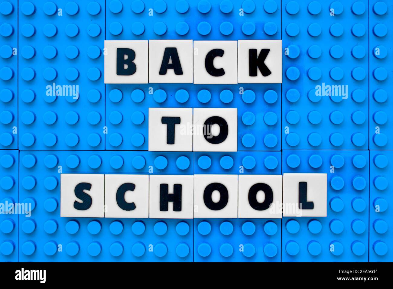 Back to School sign text build with interlocking plastic white and sky blue bricks Stock Photo