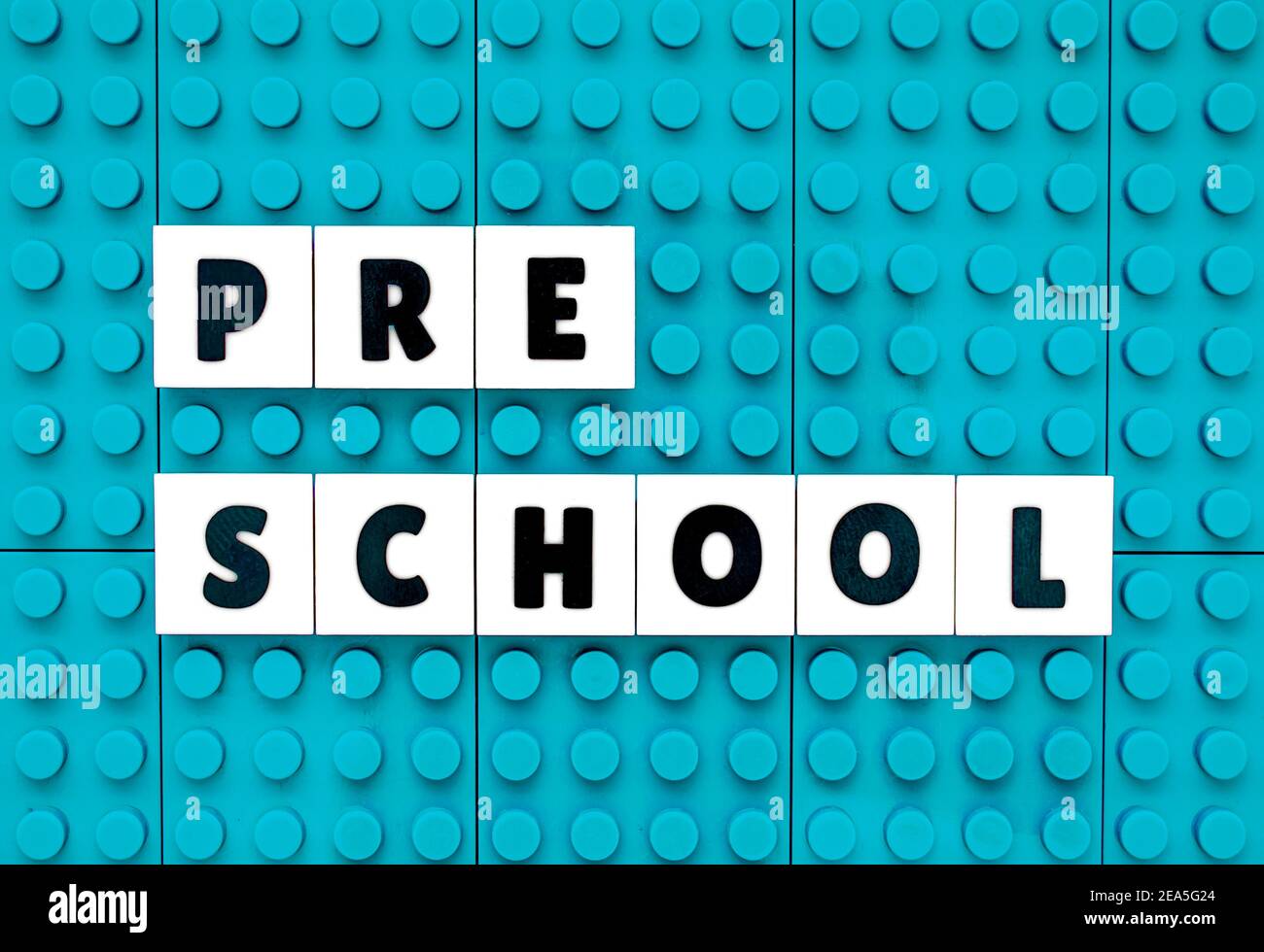 Pre-School sign text build with interlocking plastic white and sky blue bricks Stock Photo