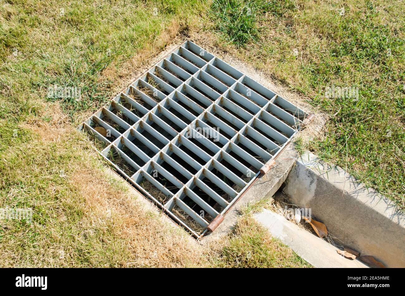 Sewer grate off the turf Stock Photo