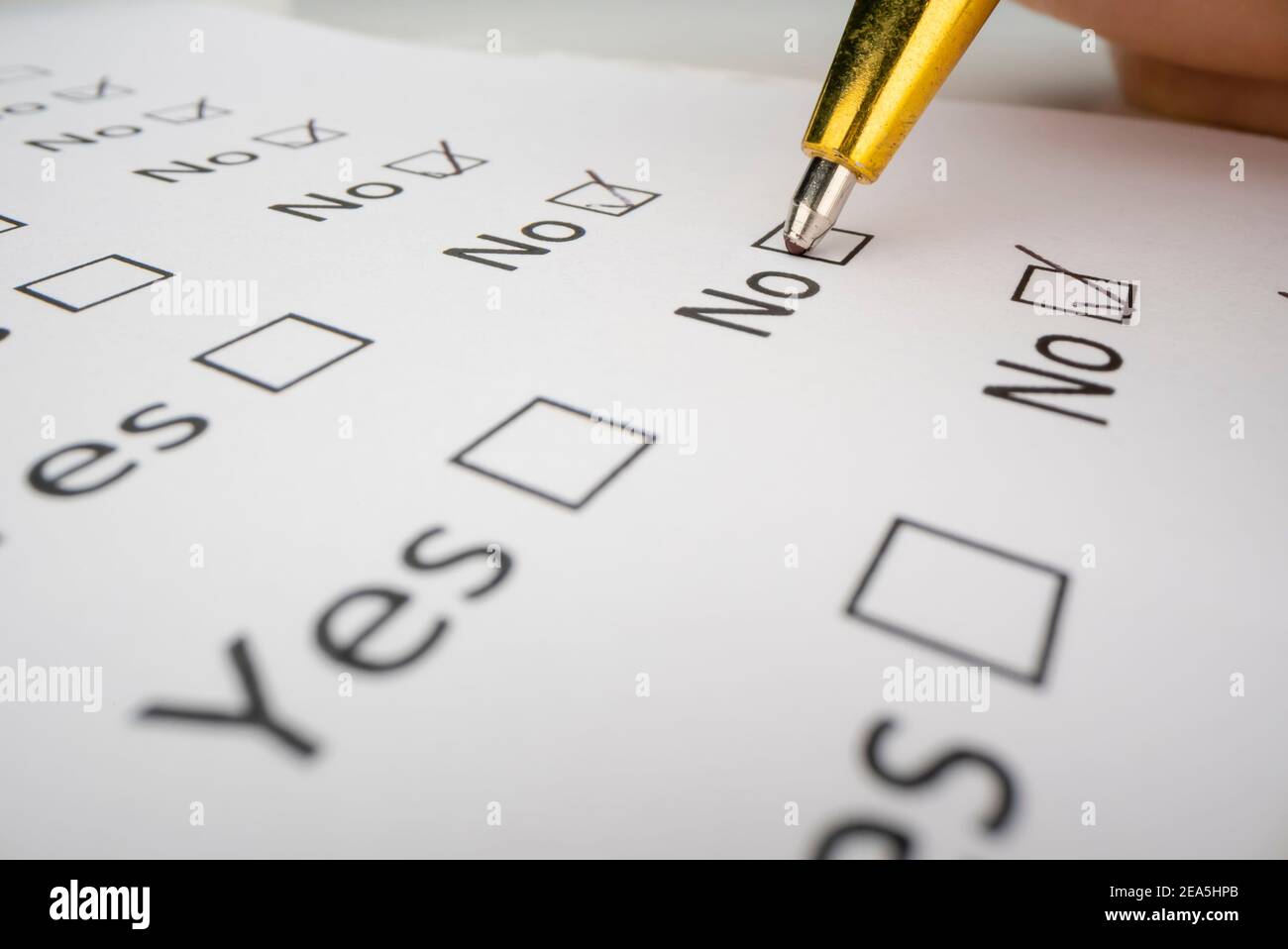 Completing a questionnaire with yes or no questions Stock Photo