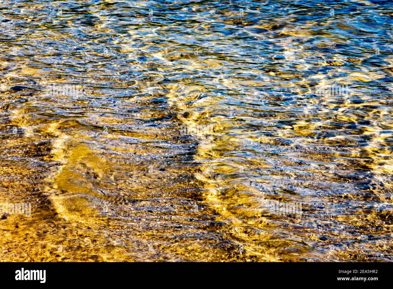 Golden ripples in the water at Gate 33 of the Quabbin Reservoir, New Salem, Massachusetts Stock Photo